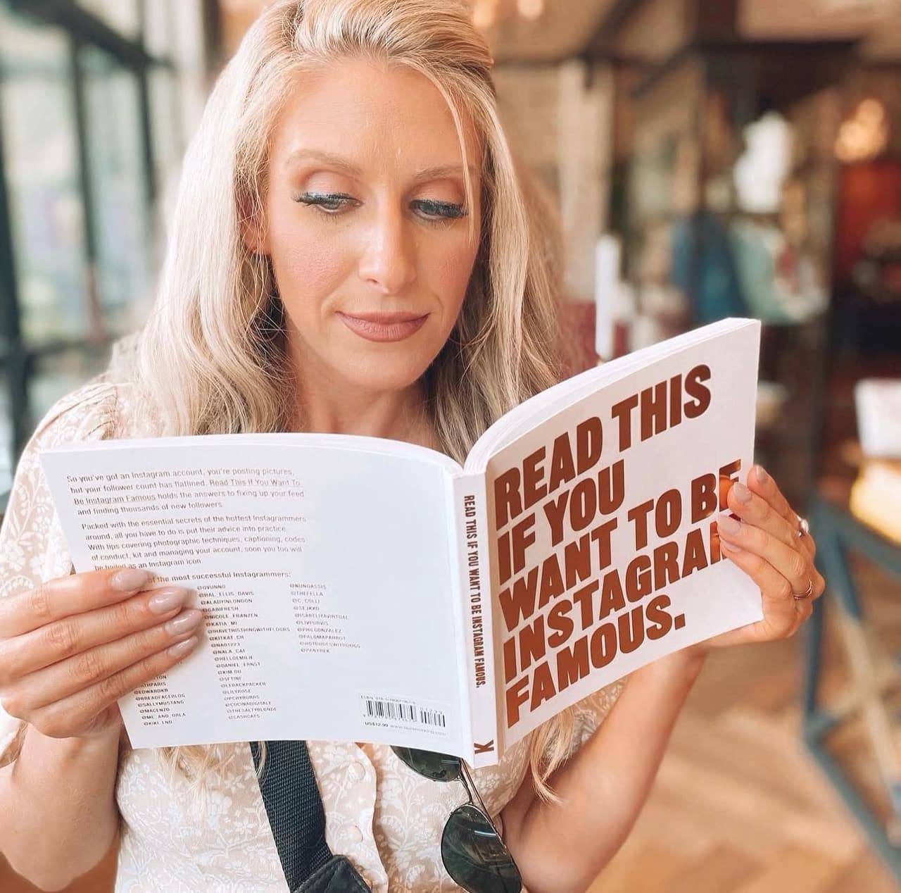 Jenn Dieas reading her book in a café
